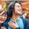 a couple laughing and walking