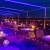 a group of tables and chairs on a rooftop terrace