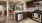 a kitchen with wooden cabinets