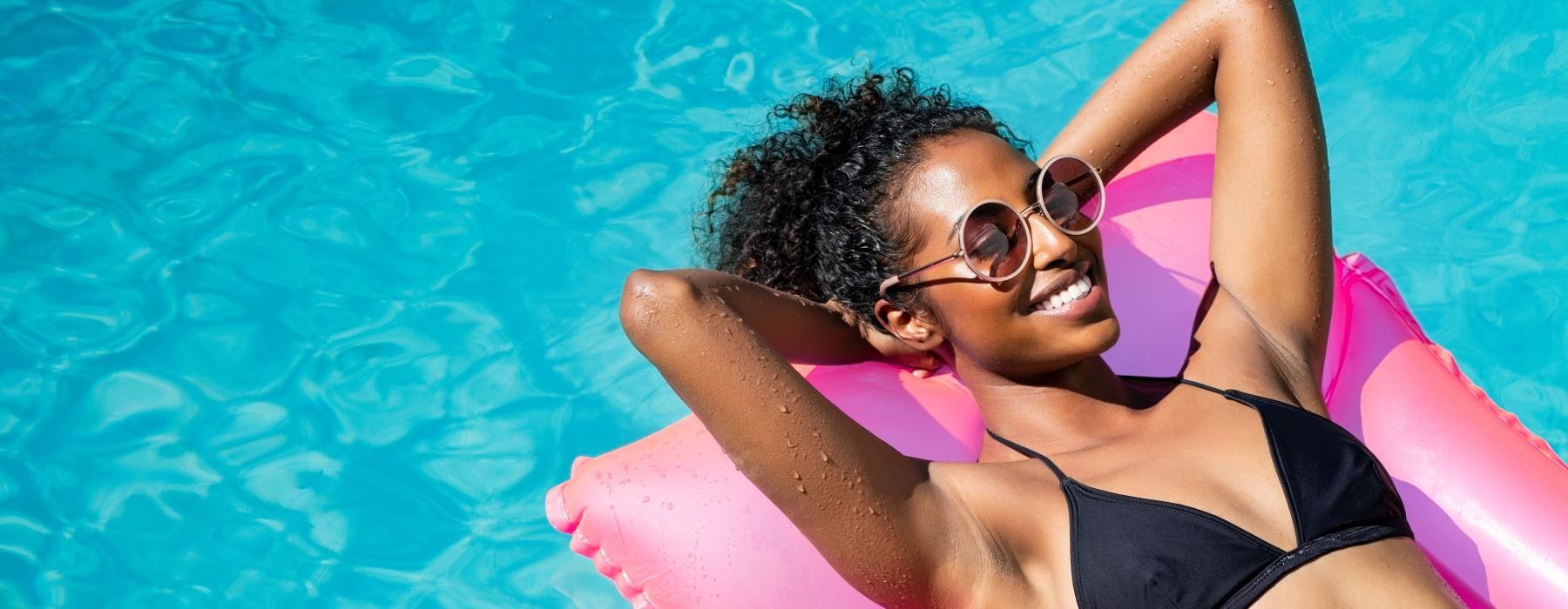 woman on a floatie in a pool