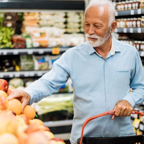 The essence of exceptional living a person holding a shopping cart in a grocery store